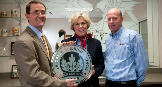 Stephen Gray (left) and Phil Seale (right) present the LEED Certification plaque