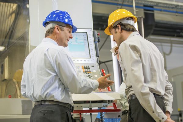 Manufacturing Plant Floor Conversation between 2 Men